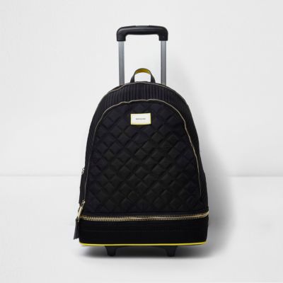 Black quilted backpack on wheels
